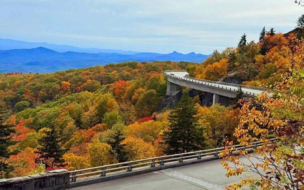 Picturesque view of a road in the Smokies surrounded by colorful fall foliage