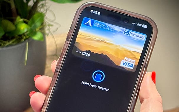 A picture of a smart phone screen with an ATFCU debit card shown on the screen